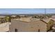 Rooftop view of a residential house, showcasing the surrounding neighborhood and distant mountain range at 10725 Wrigley Field Ave, Las Vegas, NV 89166