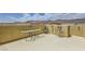 Inviting rooftop deck with an outdoor fireplace, modern seating, and beautiful mountain views for relaxing or entertaining at 10725 Wrigley Field Ave, Las Vegas, NV 89166