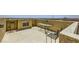 Stylish rooftop deck featuring an outdoor fireplace and modern furniture, perfect for entertaining with scenic views at 10725 Wrigley Field Ave, Las Vegas, NV 89166