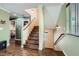 View of the staircase and landing showcasing the wood steps and natural light from the window at 10725 Wrigley Field Ave, Las Vegas, NV 89166