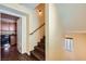 Staircase leading up, showcasing the transition between floors with a glimpse of the kitchen through an open door at 10725 Wrigley Field Ave, Las Vegas, NV 89166