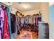 Organized walk-in closet features ample storage for clothing, shoes and accessories in an efficiently designed space at 10725 Wrigley Field Ave, Las Vegas, NV 89166