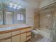 Full bath featuring tub, toilet, a tiled shower and large vanity at 1409 Santa Margarita St # G, Las Vegas, NV 89146