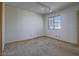 Bright bedroom features a large window and neutral color palette at 1409 Santa Margarita St # G, Las Vegas, NV 89146