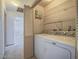 Convenient laundry room featuring shelving and updated appliances at 1409 Santa Margarita St # G, Las Vegas, NV 89146