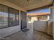 View of outdoor entry featuring iron security door and view of terracotta rooftops at 1409 Santa Margarita St # G, Las Vegas, NV 89146