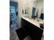 Bathroom features double sink vanity, contemporary fixtures, and a view into the toilet area at 1618 Dakota Group Ave, North Las Vegas, NV 89084
