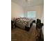 Bedroom with neutral walls, a window with blinds, and carpet flooring at 1618 Dakota Group Ave, North Las Vegas, NV 89084