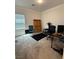 Bedroom with carpet flooring, a large window, and various furniture at 1618 Dakota Group Ave, North Las Vegas, NV 89084