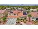 Beautiful two-story home with a red tile roof, solar panels, and a well-maintained landscape at 2010 Catalina Marie Ave, Henderson, NV 89074