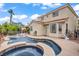 Beautiful backyard with a pool, spa, covered patio, and well-maintained landscaping for outdoor living at 2010 Catalina Marie Ave, Henderson, NV 89074