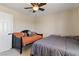 Cozy bedroom with ceiling fan features two beds, offering flexible sleeping arrangements at 2010 Catalina Marie Ave, Henderson, NV 89074