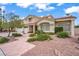 Inviting two-story home with a three-car garage, desert landscaping and stylish architectural details at 2010 Catalina Marie Ave, Henderson, NV 89074