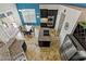 Modern kitchen features granite countertops, stainless steel appliances, and tile flooring at 2010 Catalina Marie Ave, Henderson, NV 89074