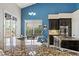 Gourmet kitchen with granite countertops, stainless steel appliances, and a view of the breakfast nook at 2010 Catalina Marie Ave, Henderson, NV 89074
