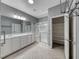 Neutral bathroom with double sinks, glass enclosed shower, and shelved closet, creating a functional space at 2154 Idaho Falls Dr, Henderson, NV 89044