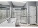 Bathroom featuring a glass shower and a sink with a mirror, designed for comfort and accessibility at 2154 Idaho Falls Dr, Henderson, NV 89044