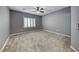 Spacious bedroom with neutral carpeting and shuttered window at 2154 Idaho Falls Dr, Henderson, NV 89044