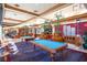 Spacious billiards room with multiple pool tables and ample seating offers a relaxed atmosphere at 2154 Idaho Falls Dr, Henderson, NV 89044