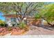 Charming single-story home with a well-manicured front yard and a brick driveway at 2154 Idaho Falls Dr, Henderson, NV 89044