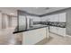 Kitchen boasting stainless steel appliances, white cabinets, and a large black countertop island at 2154 Idaho Falls Dr, Henderson, NV 89044