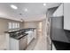 Open floor plan boasts a kitchen with an island, stainless appliances, and breakfast bar at 2154 Idaho Falls Dr, Henderson, NV 89044