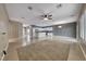 Open-concept living space with tile floors, ceiling fan and abundant natural light at 2154 Idaho Falls Dr, Henderson, NV 89044