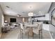 Bright living area with modern furnishings, an open layout, and a stylish dining space adjacent to a well-equipped kitchen at 2154 Idaho Falls Dr, Henderson, NV 89044