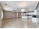 Open-concept living room featuring tile floors and seamless connection to a modern kitchen area at 2154 Idaho Falls Dr, Henderson, NV 89044