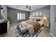 Relaxing bedroom featuring neutral tones, a comfortable bed, shuttered windows, and tasteful decor at 2154 Idaho Falls Dr, Henderson, NV 89044