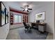 Home office space with a built-in desk, shelving, a comfortable chair, and natural light, perfect for productivity at 2154 Idaho Falls Dr, Henderson, NV 89044