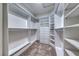 Walk-in closet with custom shelving and drawers for organized storage at 2154 Idaho Falls Dr, Henderson, NV 89044