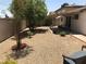 Large backyard featuring rock ground cover and a covered patio at 308 Sunbeam Dr, Las Vegas, NV 89107