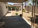 Cozy backyard features rock ground cover, bench, and covered patio at 308 Sunbeam Dr, Las Vegas, NV 89107