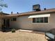 Exterior of home featuring backyard with rock ground cover, awning, and covered patio at 308 Sunbeam Dr, Las Vegas, NV 89107