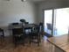 Comfortable dining area with sliding glass doors providing access to the outdoor patio space at 308 Sunbeam Dr, Las Vegas, NV 89107