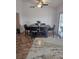 Bright dining area features modern table and chairs, and a sliding glass door to a patio at 308 Sunbeam Dr, Las Vegas, NV 89107