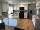 Well-equipped kitchen with granite countertops, stainless steel appliances, and ample cabinet space at 308 Sunbeam Dr, Las Vegas, NV 89107