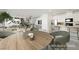 Chic dining area with a round table, modern chairs, and bright natural light at 3240 Avernus Ave, Henderson, NV 89044