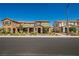 Charming townhome with a stone facade, covered porch, and manicured landscaping in a vibrant community at 3240 Avernus Ave, Henderson, NV 89044