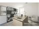 Modern home office with stylish shelving, a spacious desk, and a comfortable seating area at 3240 Avernus Ave, Henderson, NV 89044