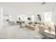 Spacious open-plan living area with modern decor, natural light, and stylish furnishings at 3240 Avernus Ave, Henderson, NV 89044