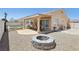 A private backyard featuring a fire pit, outdoor dining and BBQ, and a pool area for relaxation at 3538 Canter Dr, North Las Vegas, NV 89032