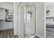 Modern shower with glass door and silver fixtures leading into the main bedroom at 3538 Canter Dr, North Las Vegas, NV 89032