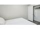 Neutral bedroom featuring a closet with sliding doors and minimalist design at 3538 Canter Dr, North Las Vegas, NV 89032