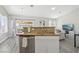 The kitchen island sink overlooks the backyard and living area at 3538 Canter Dr, North Las Vegas, NV 89032