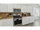 Updated kitchen has stainless steel appliances and ample counter space at 3538 Canter Dr, North Las Vegas, NV 89032