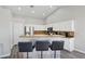 The kitchen island provides extra seating and counter space at 3538 Canter Dr, North Las Vegas, NV 89032