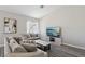 Comfortable living room featuring modern gray sofas, stylish coffee table, neutral walls, and contemporary decor at 3538 Canter Dr, North Las Vegas, NV 89032