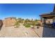 Exterior view of backyard featuring rock landscaping, a shed and covered patio at 357 S Milan St, Henderson, NV 89015